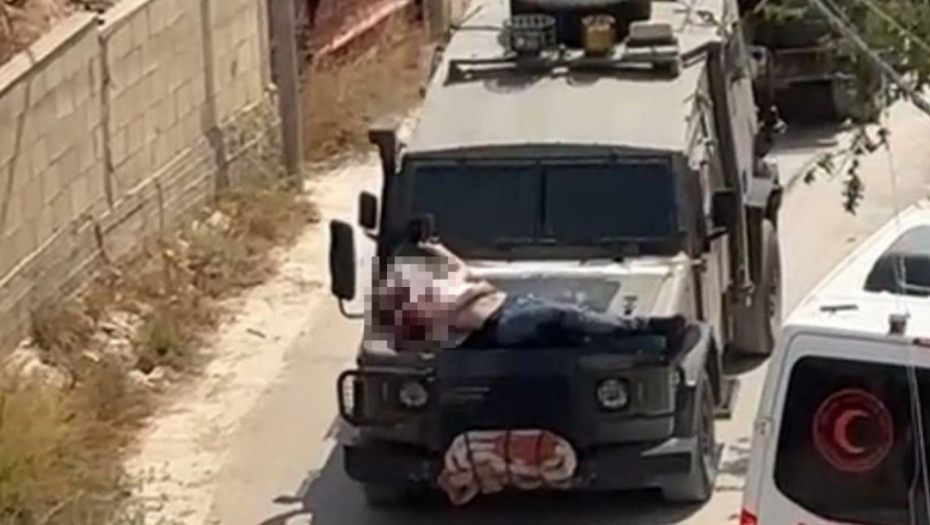 JEZIVO! GDE JE TA ZAPADNA IZUZETNOST SADA? Ranjenog Palestinca vezali kao vepra za haubu, snimak zapalio mreže (VIDEO)